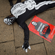 An environmental protester lies on the ground as he demonstrates against recent government plans to mine coal and open a coal-fired power plant, in downtown Nairobi, Kenya Tuesday, June 5, 2018. Kenyan activists protested plans for the joint venture between the Kenyan and Chinese governments in Lamu County, saying it will have devastating effect on the environment and health of local populations.